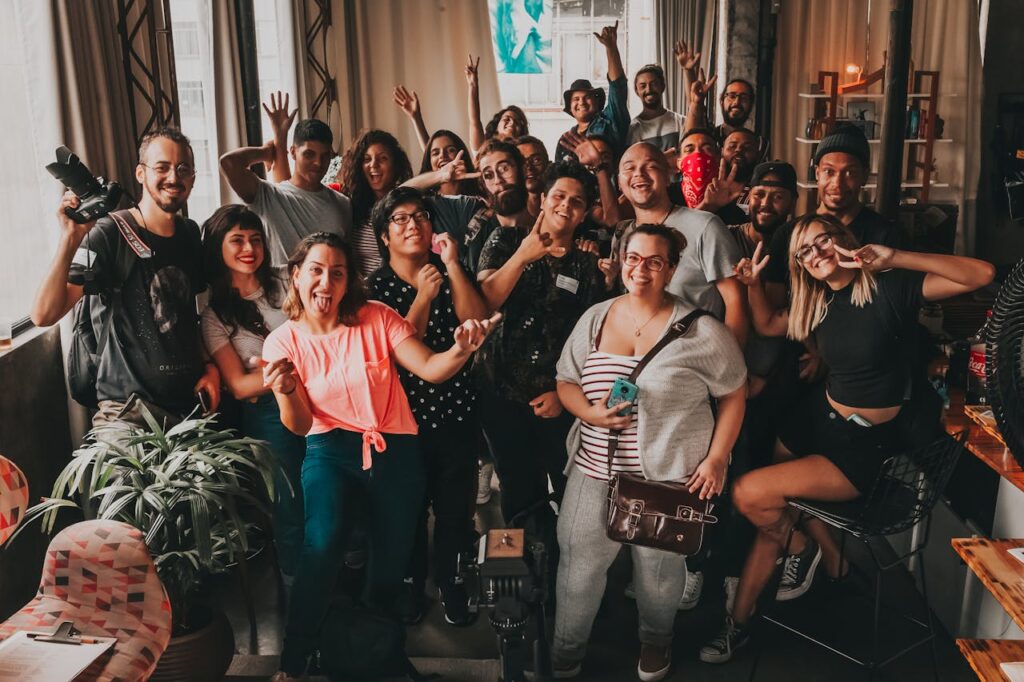 Diverse group enjoying a cheerful meeting indoors in São Paulo, capturing unity and joy.